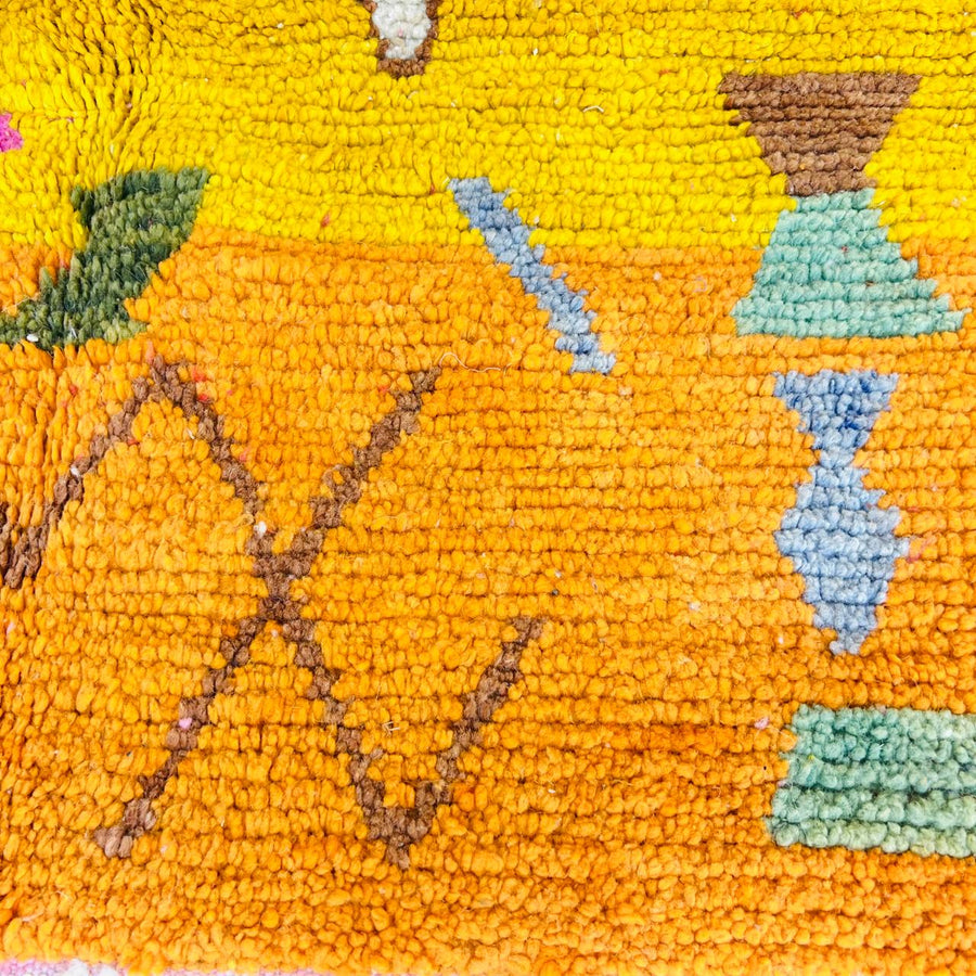 Vintage Moroccan wool rug with colorful abstract Berber symbols in pink and yellow