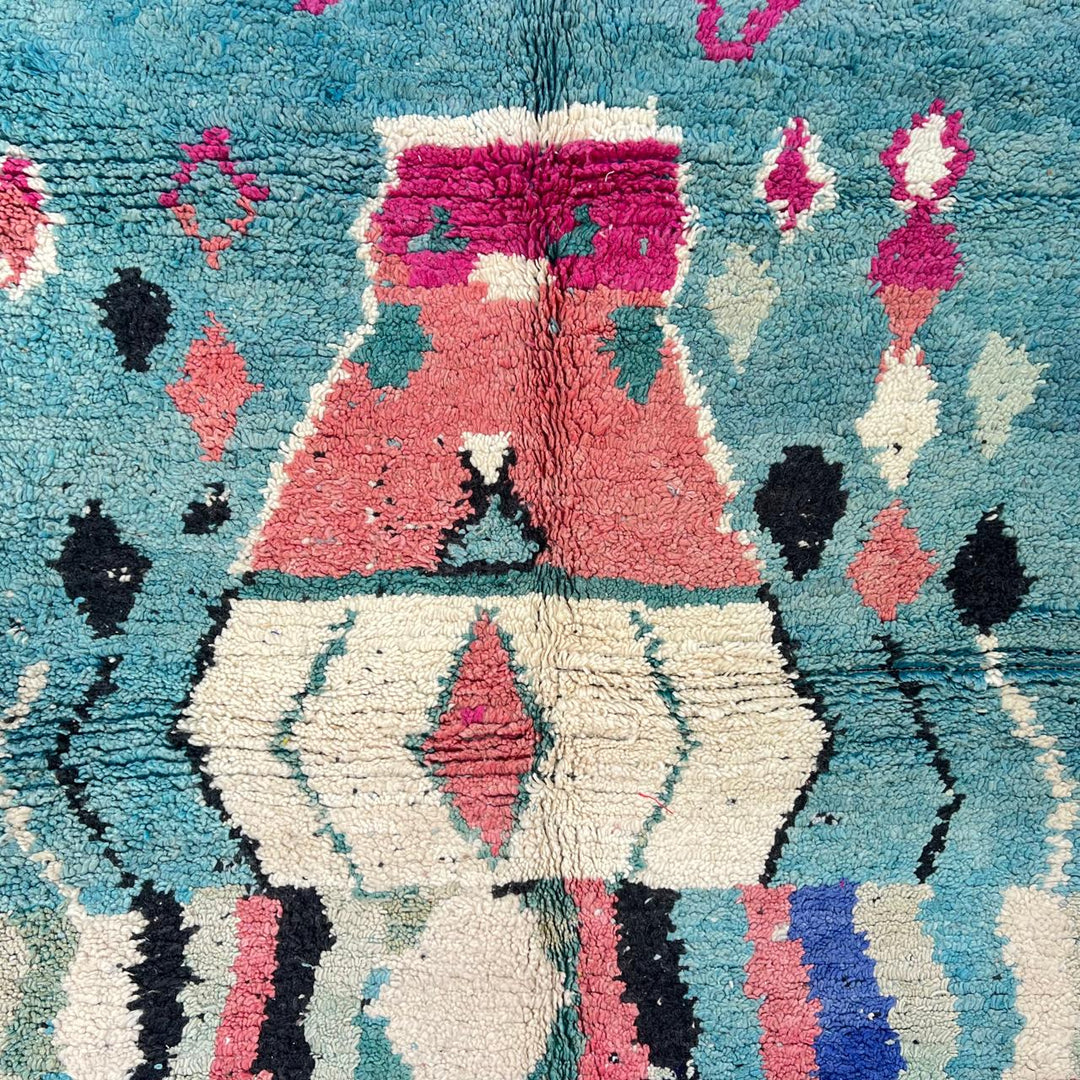 Vintage Moroccan wool rug in turquoise and pink tones with tribal Berber patterns, handmade in Morocco