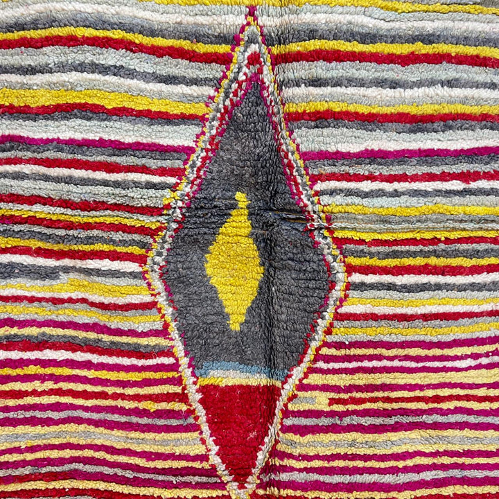 Vintage Moroccan wool rug with red, yellow, grey and ivory stripes and central diamond motif, handwoven Berber rug 235x152 cm
