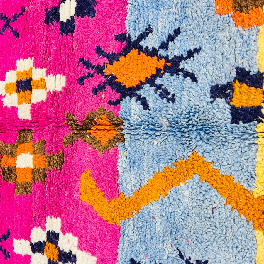 Vintage Moroccan wool rug with colorful Berber tribal symbols, handmade in Morocco