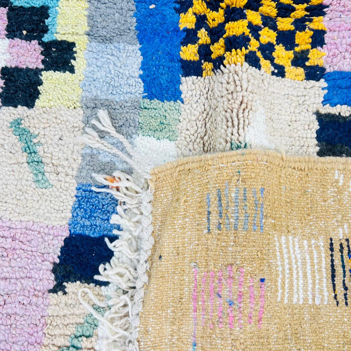 Vintage Moroccan wool rug with colorful patchwork Berber geometric design in pastel tones, handmade in Morocco
