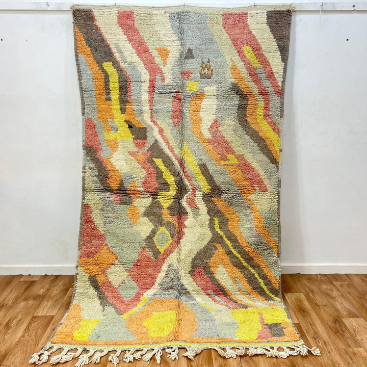 Vintage Moroccan wool rug with abstract Berber pattern in earthy tones, handmade in Morocco
