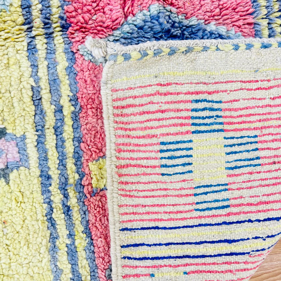 Vintage Moroccan wool rug with colorful Berber geometric patterns, handmade in Morocco