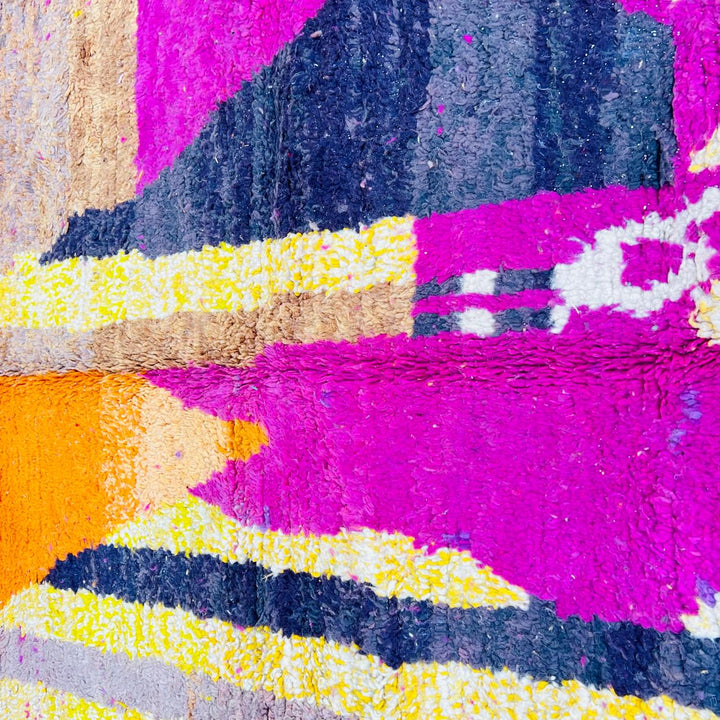 Handmade vintage Moroccan wool rug in pink and yellow with abstract Berber design. One-of-a-kind artisan rug, 255×166 cm.