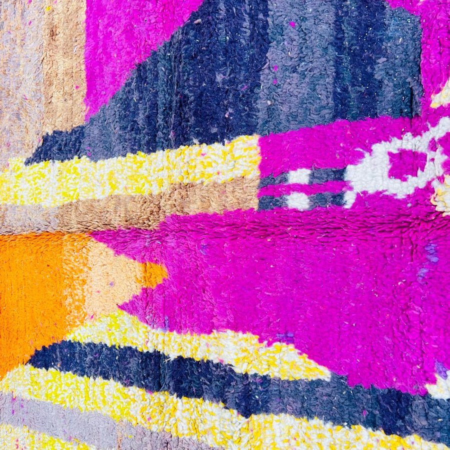 Handmade vintage Moroccan wool rug in pink and yellow with abstract Berber design. One-of-a-kind artisan rug, 255×166 cm.