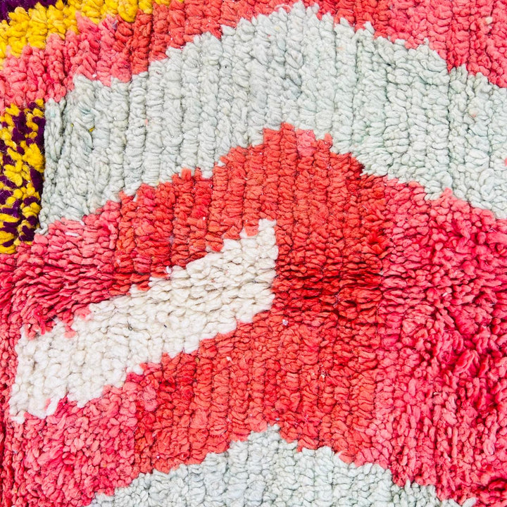 Vintage Moroccan wool rug with abstract Berber geometric design in coral pink, mustard yellow, navy and cream, handmade in Morocco