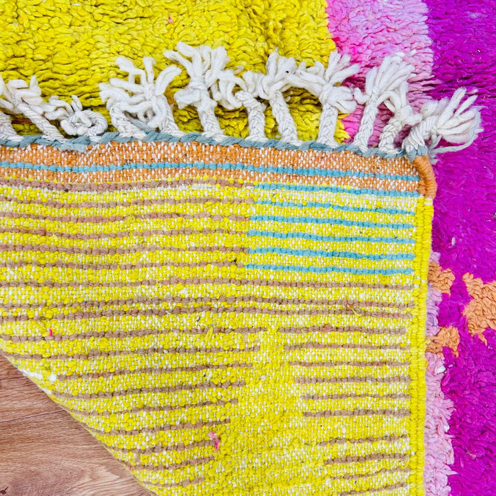 Vintage Moroccan wool rug with pink Berber tribal symbols, handmade in Morocco