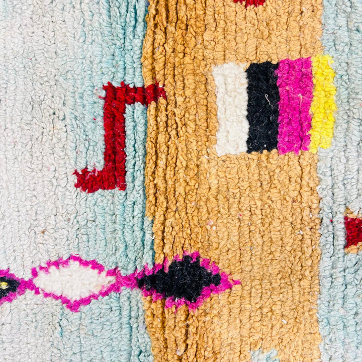 Vintage Moroccan wool rug with colorful Berber geometric symbols, handmade in Morocco