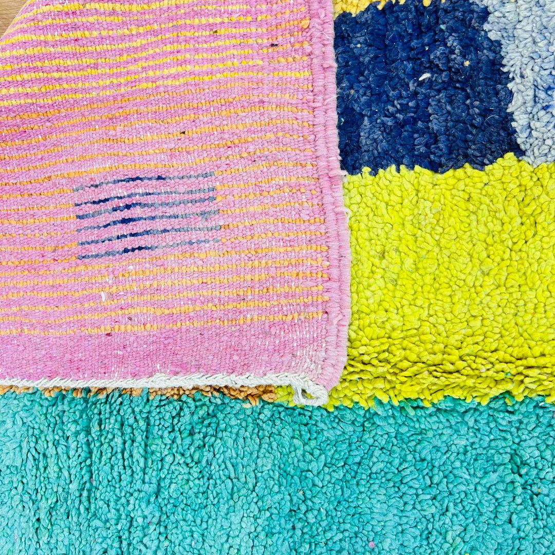 Vintage Moroccan wool rug with colorful geometric Berber pattern, handmade in Morocco
