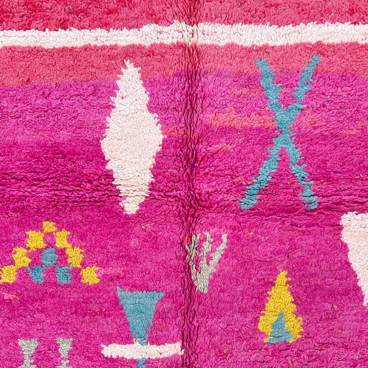 Vintage Moroccan wool rug in pink and yellow tones with abstract Berber geometric patterns, handmade in Morocco