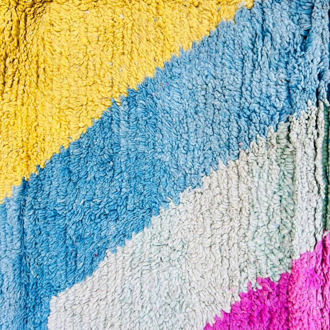 Vintage Moroccan wool rug with colorful Berber geometric and symbolic pattern, handmade in Morocco