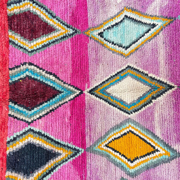 Vintage Moroccan wool rug with purple background and colorful diamond Berber patterns, handmade in Morocco