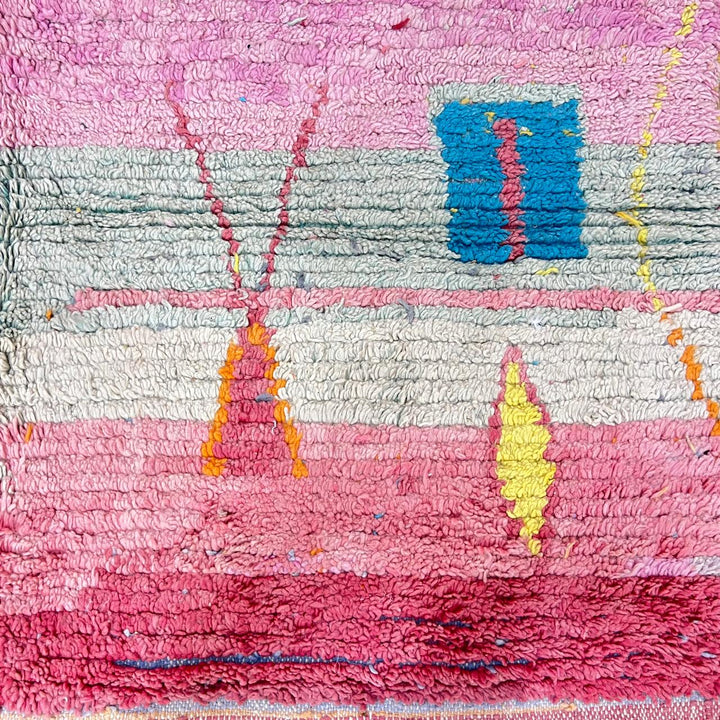 Vintage Moroccan wool rug with pink tones and abstract Berber symbols, handmade in Morocco