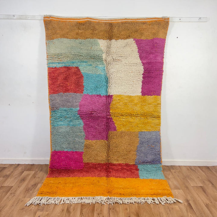 Vintage Moroccan wool rug with colorful patchwork blocks in orange, pink, yellow and blue tones, handmade Berber rug 8.33 x 5.09 ft