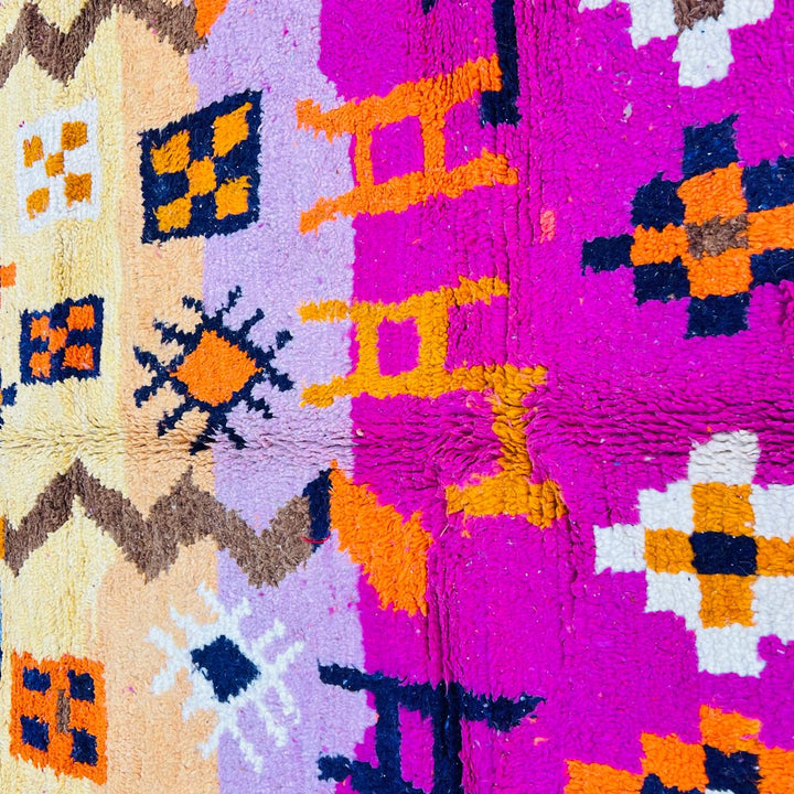 Vintage Moroccan wool rug with colorful Berber tribal symbols, handmade in Morocco