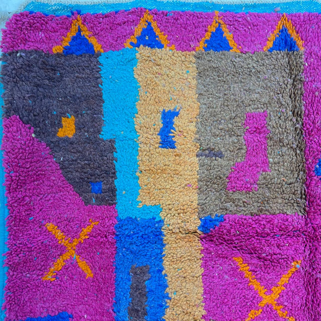 Vintage Moroccan wool rug with colorful Berber geometric patterns in pink, blue, and orange