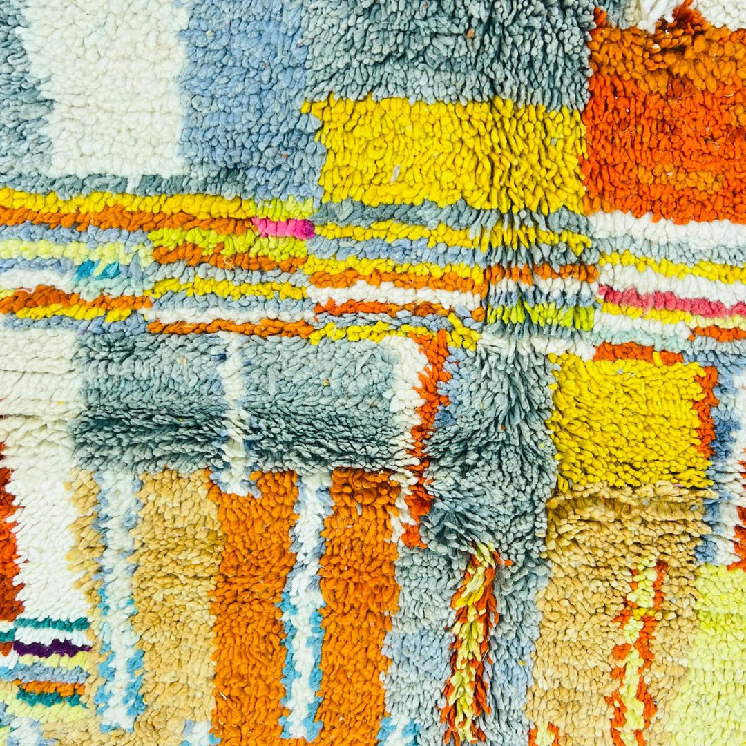 Vintage Moroccan wool rug with geometric patterns in yellow, grey, teal and orange – handmade Berber rug from Morocco