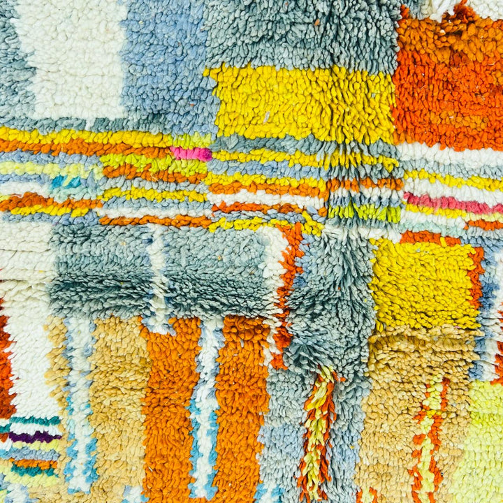 Vintage Moroccan wool rug with geometric patterns in yellow, grey, teal and orange – handmade Berber rug from Morocco
