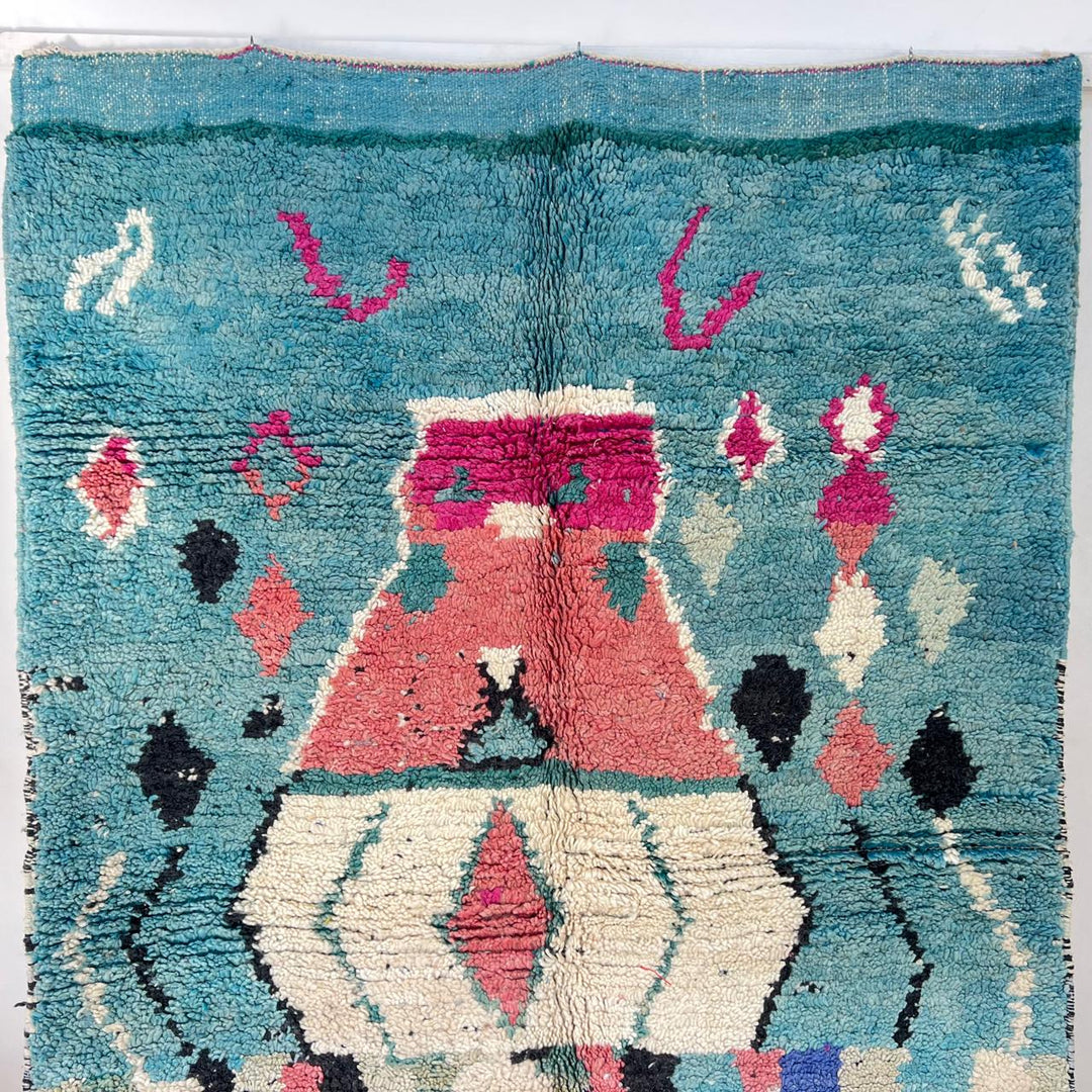 Vintage Moroccan wool rug in turquoise and pink tones with tribal Berber patterns, handmade in Morocco