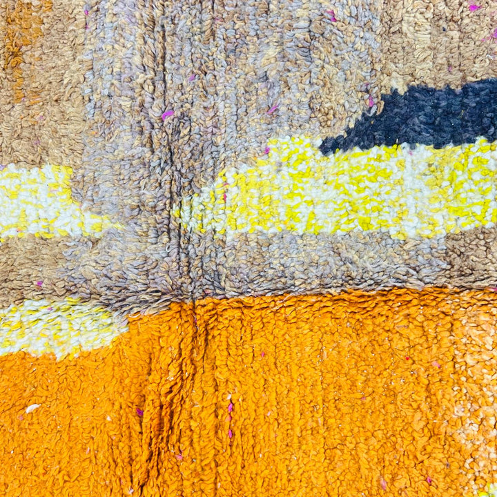 Handmade vintage Moroccan wool rug in pink and yellow with abstract Berber design. One-of-a-kind artisan rug, 255×166 cm.
