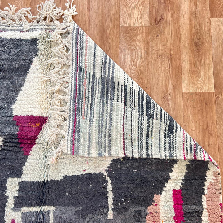 Vintage Moroccan wool rug with colorful abstract Berber geometric design in burgundy, pink, yellow and grey tones