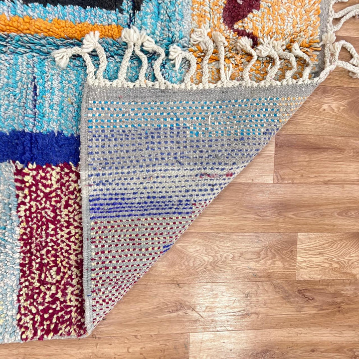 Vintage Moroccan wool rug with abstract vertical stripes in blue, burgundy, cream, and mustard tones