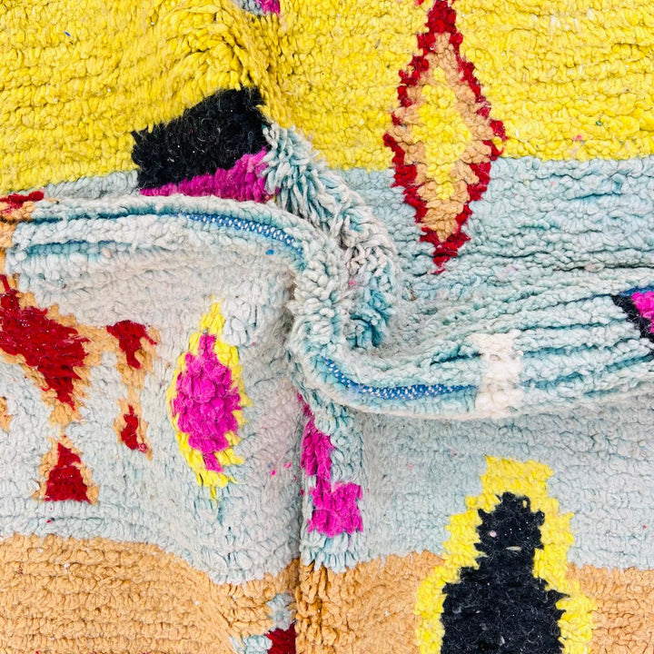 Vintage Moroccan wool rug with colorful Berber geometric symbols, handmade in Morocco