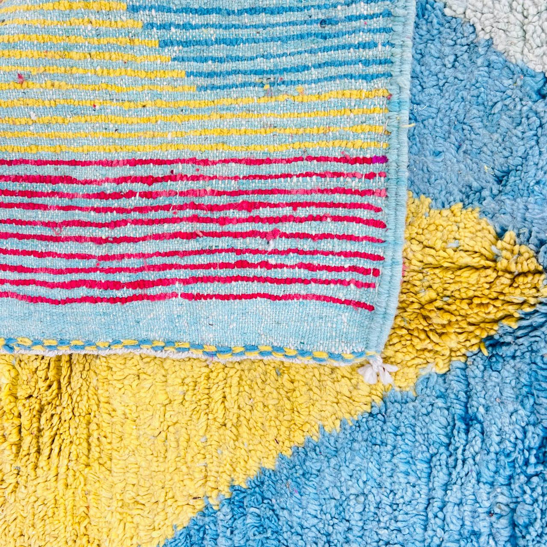 Vintage Moroccan wool rug with colorful Berber geometric and symbolic pattern, handmade in Morocco