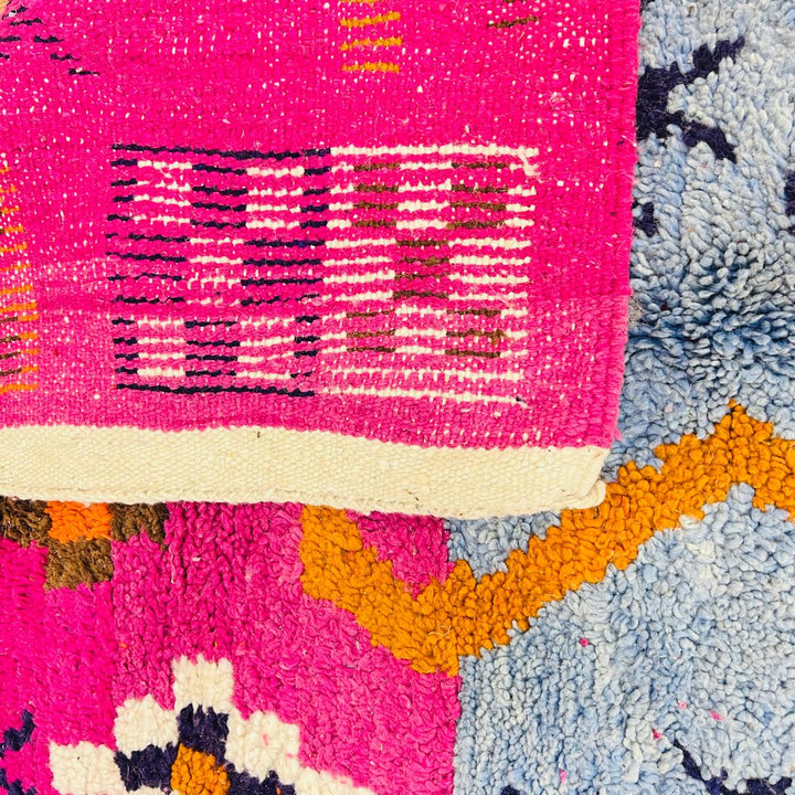 Vintage Moroccan wool rug with colorful Berber tribal symbols, handmade in Morocco