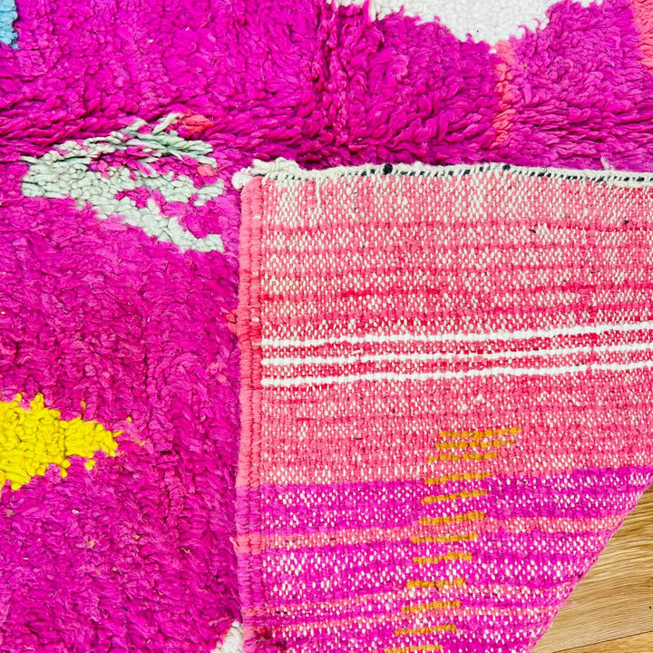 Vintage Moroccan wool rug with pink Berber tribal symbols, handmade in Morocco