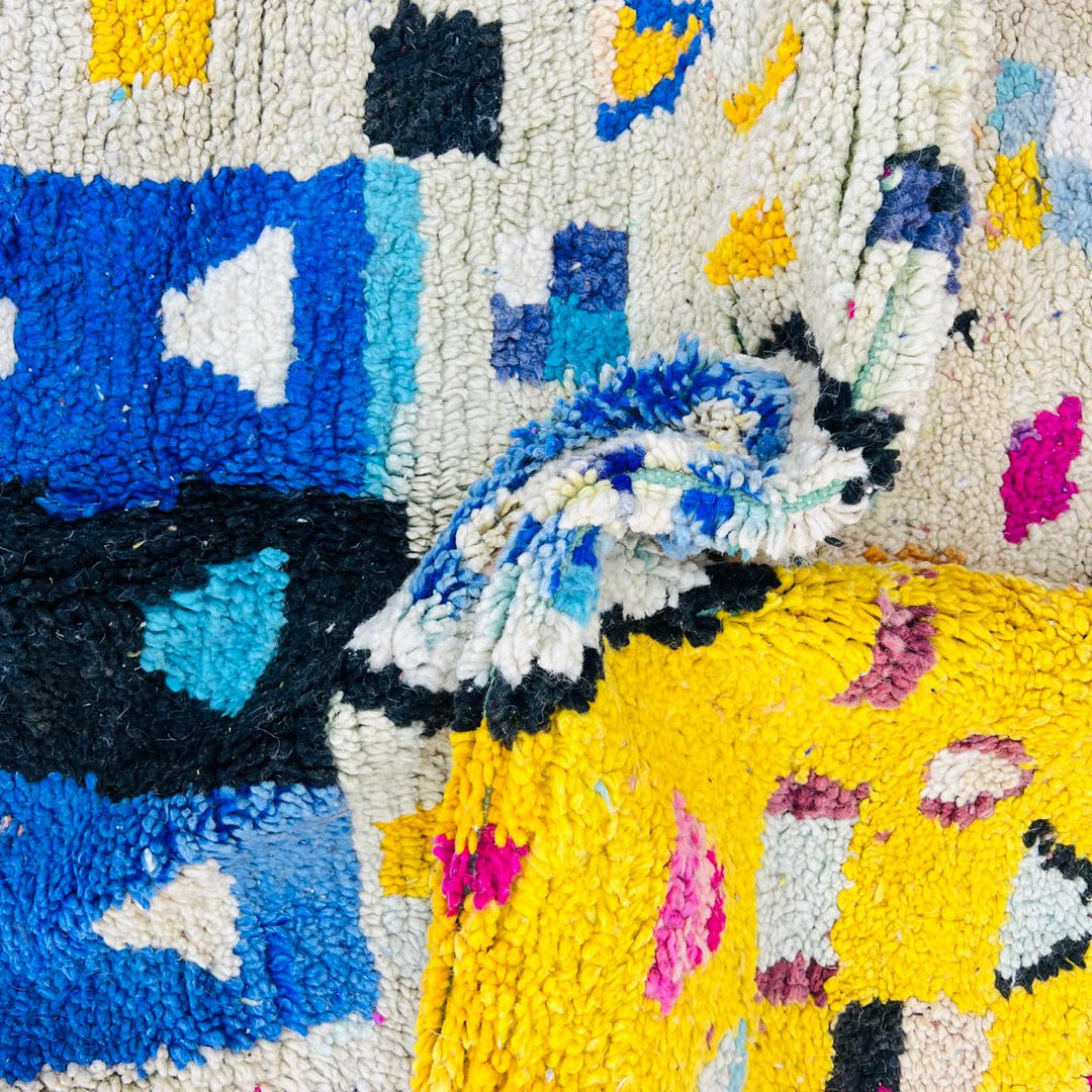Vintage Moroccan wool rug with colorful geometric Berber pattern, handmade in Morocco