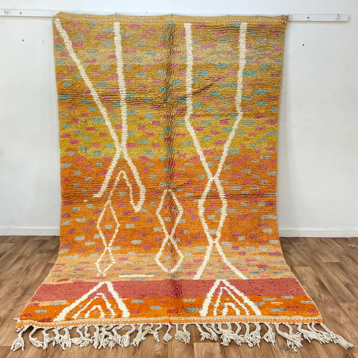 Vintage Moroccan wool rug in orange tones with white Berber diamond patterns, handmade in Morocco