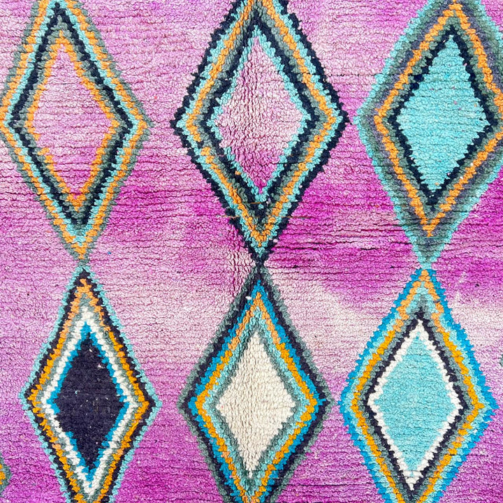Vintage Moroccan wool rug with purple background and colorful diamond Berber patterns, handmade in Morocco