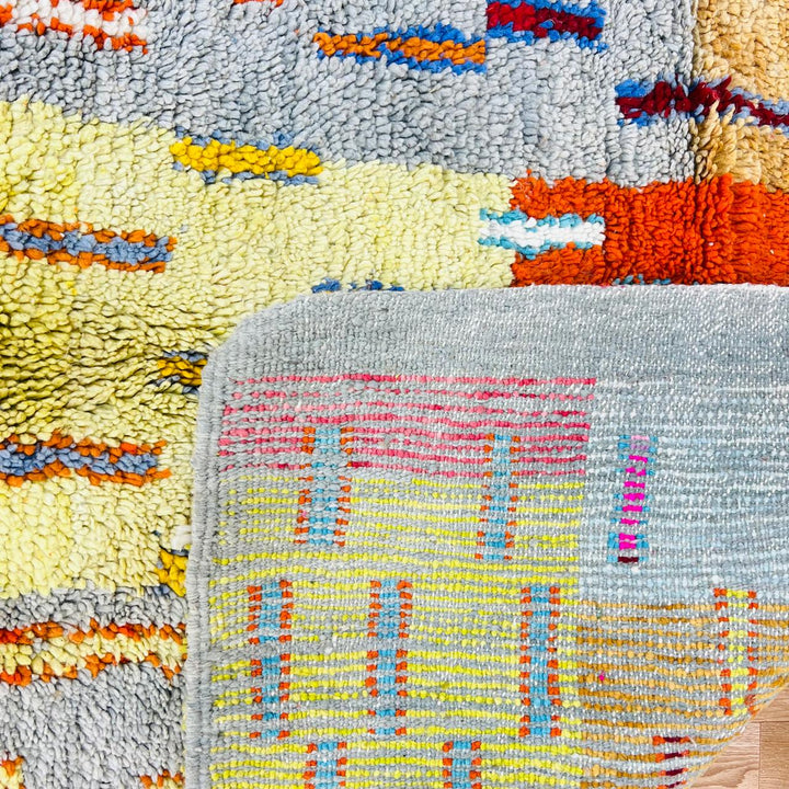Vintage Moroccan wool rug with geometric patterns in yellow, grey, teal and orange – handmade Berber rug from Morocco
