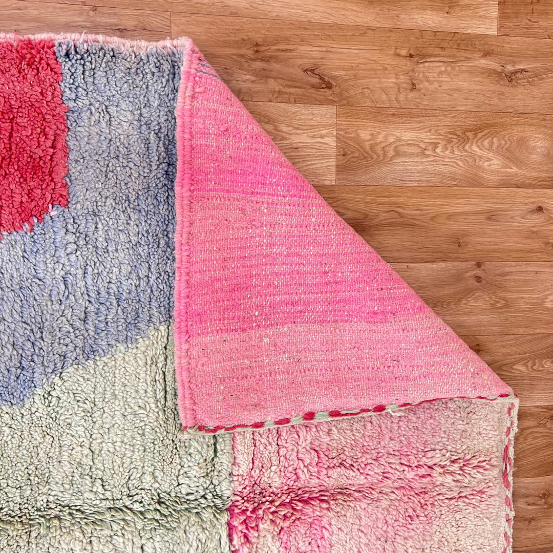 Vintage Moroccan wool rug with abstract Berber pattern in pink, yellow and blue