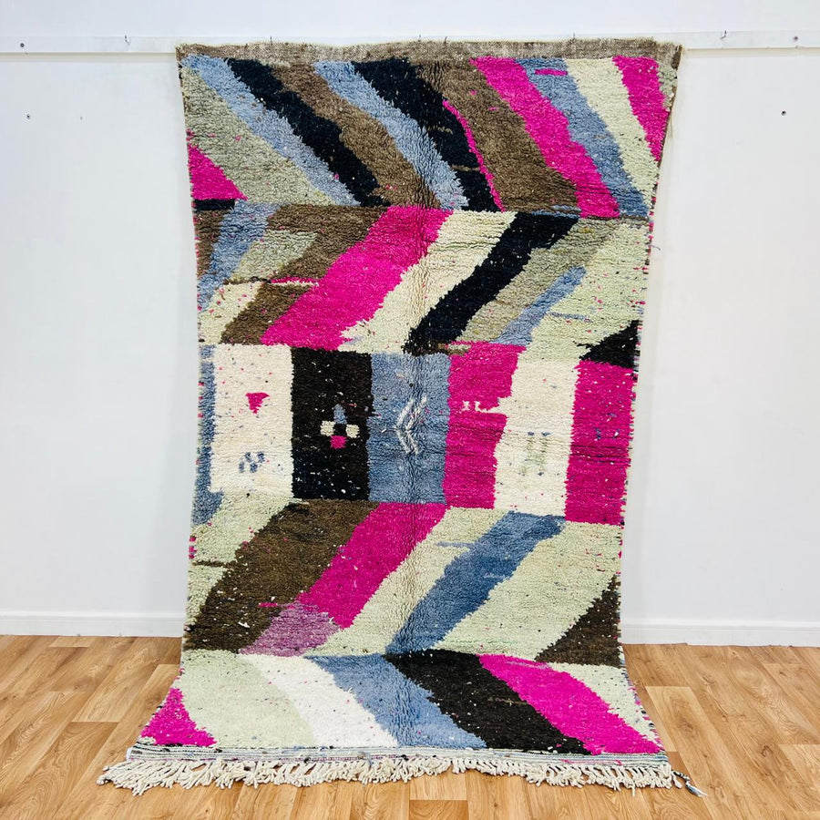Vintage Moroccan wool rug with abstract Berber geometric pattern in pink, ivory, blue, and black