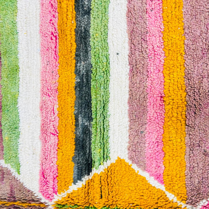 Vintage Moroccan wool rug with colorful Berber diamond and stripe patterns in pink, green and mustard