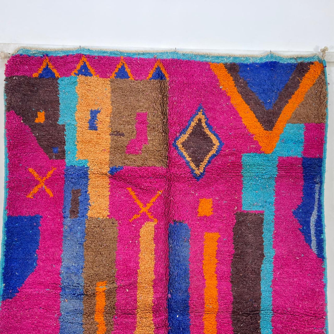 Vintage Moroccan wool rug with colorful Berber geometric patterns in pink, blue, and orange