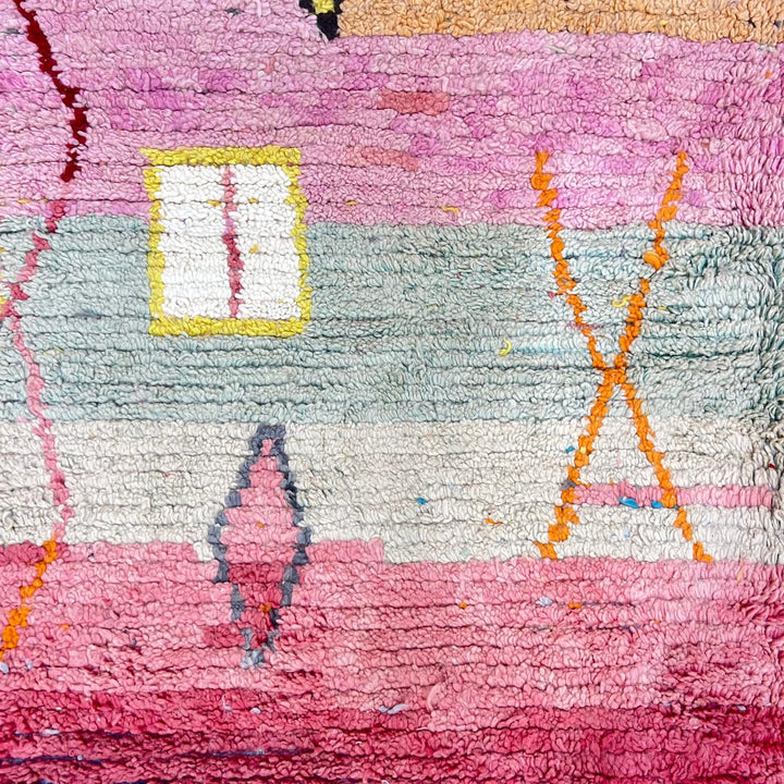 Vintage Moroccan wool rug with pink tones and abstract Berber symbols, handmade in Morocco