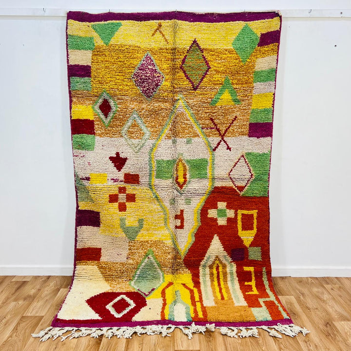 Vintage Moroccan wool rug with colorful Berber geometric symbols, handmade in Morocco