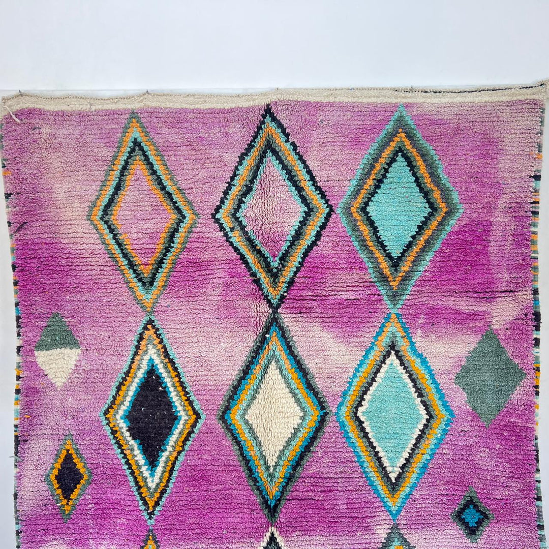 Vintage Moroccan wool rug with purple background and colorful diamond Berber patterns, handmade in Morocco