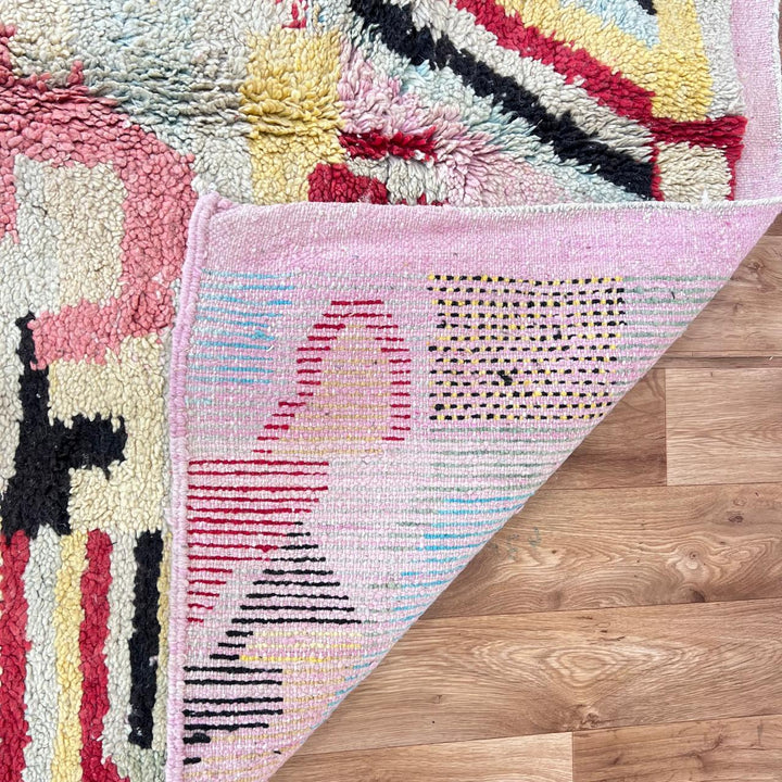 Vintage Moroccan wool rug with colorful patchwork Berber patterns, handmade in Morocco