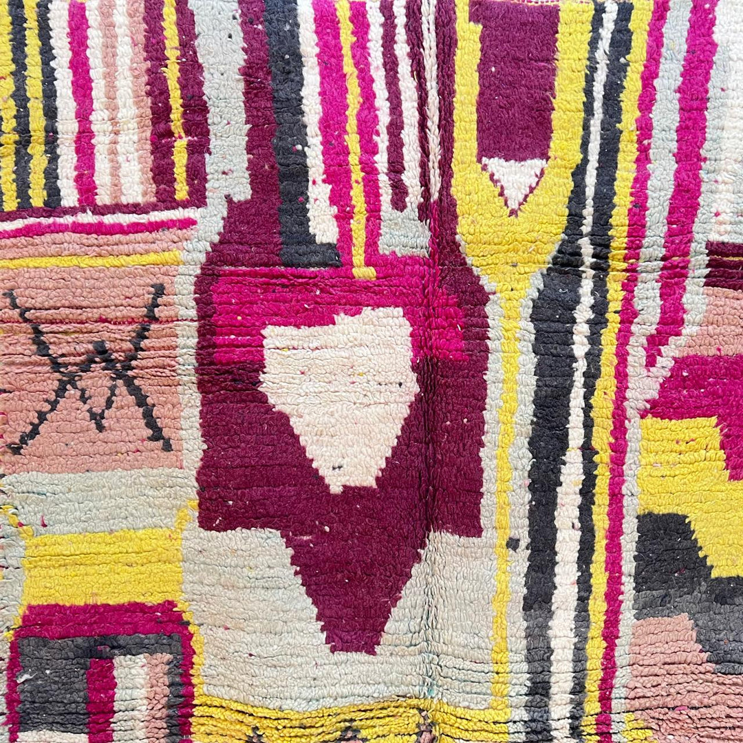 Vintage Moroccan wool rug with colorful abstract Berber geometric design in burgundy, pink, yellow and grey tones
