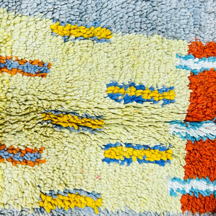 Vintage Moroccan wool rug with geometric patterns in yellow, grey, teal and orange – handmade Berber rug from Morocco