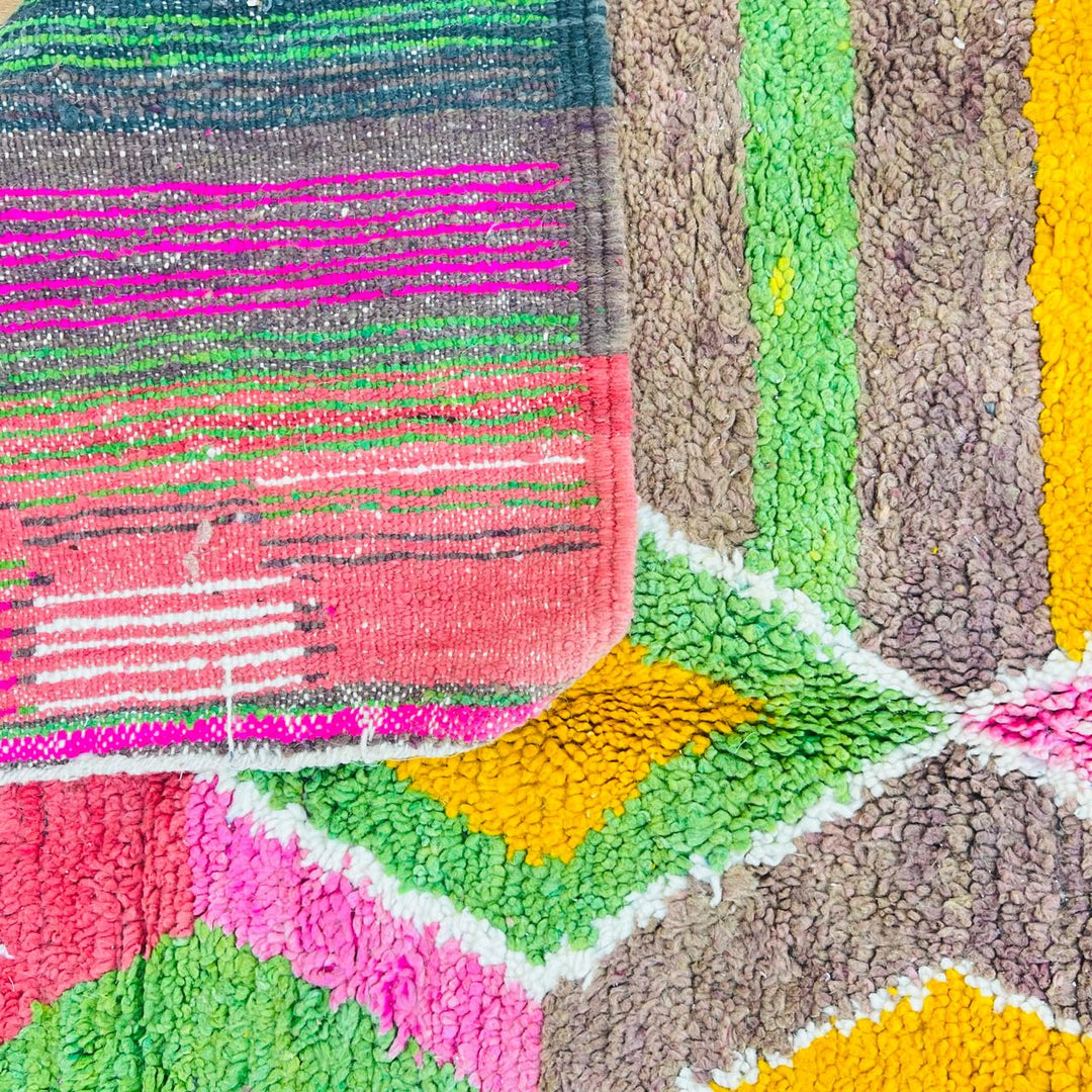 Vintage Moroccan wool rug with colorful Berber diamond and stripe patterns in pink, green and mustard