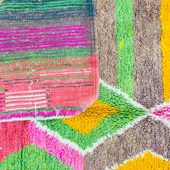 Vintage Moroccan wool rug with colorful Berber diamond and stripe patterns in pink, green and mustard