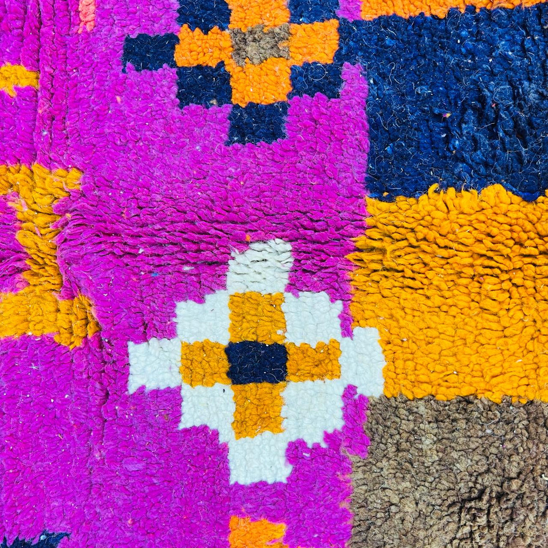 Vintage Moroccan wool rug with colorful Berber tribal symbols, handmade in Morocco
