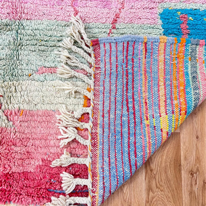 Vintage Moroccan wool rug with pink tones and abstract Berber symbols, handmade in Morocco