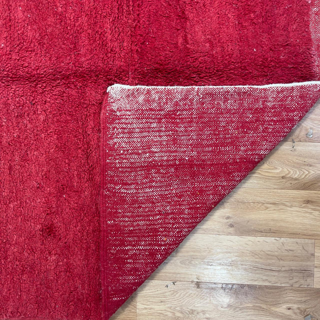 Vintage Moroccan wool rug in deep red with abstract black, ivory, and blue color blocks, handmade Berber rug