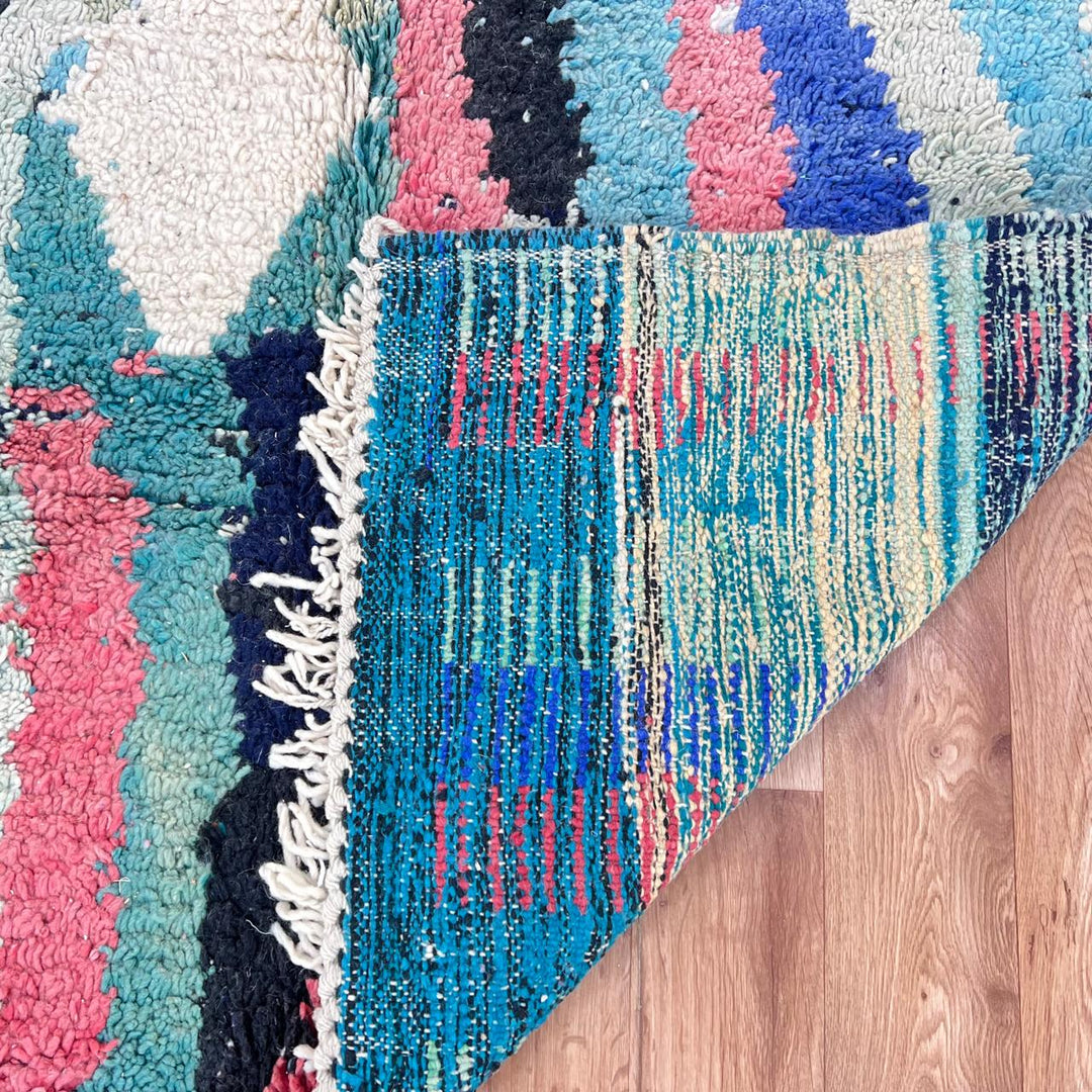 Vintage Moroccan wool rug in turquoise and pink tones with tribal Berber patterns, handmade in Morocco